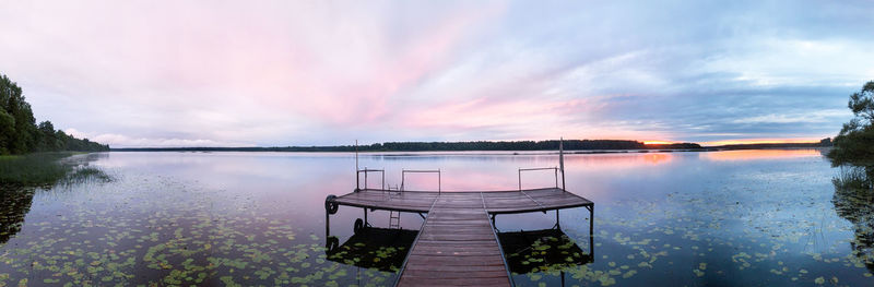 Scenic view of river against sky during sunset