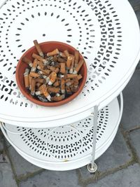 High angle view of cigarette in bowl on table