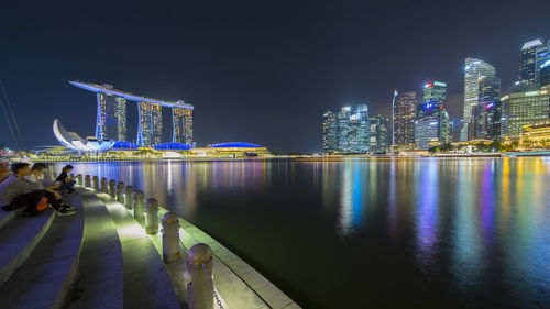 Illuminated buildings in city at night