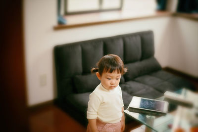 Boy standing at home