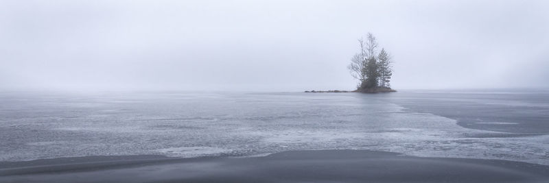 Scenic view of frozen lake against sky