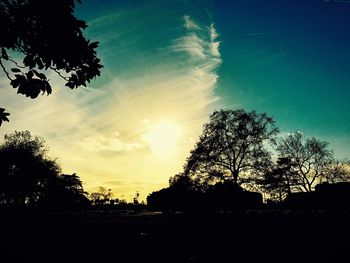 Silhouette of trees against sky at sunset