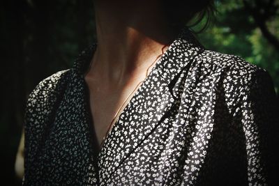 Midsection of woman standing outdoors