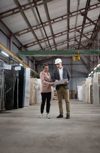 Full length of people standing in building