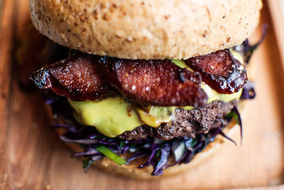 Close-up of hamburger served in brown plate