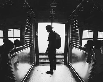 Silhouette of people at railroad station