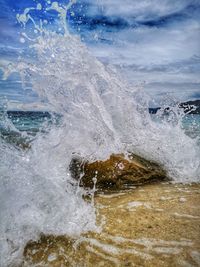 Sea waves splashing on rocks