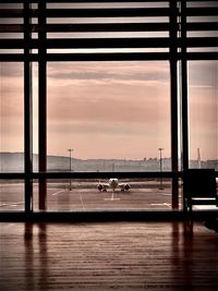 View of airport runway at sunset