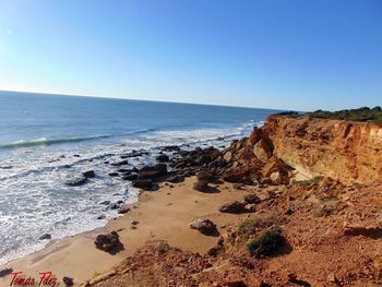 Scenic view of beach against clear sky