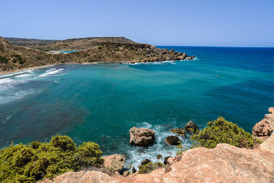 Scenic view of sea against clear blue sky