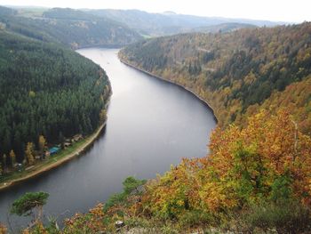 Scenic view of river amidst mountains