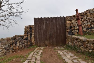 Staircase leading to brick wall