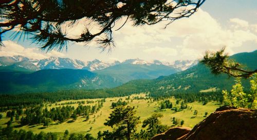 Scenic view of mountains against cloudy sky