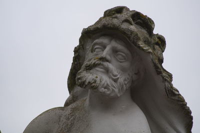 Low angle view of statue against sky