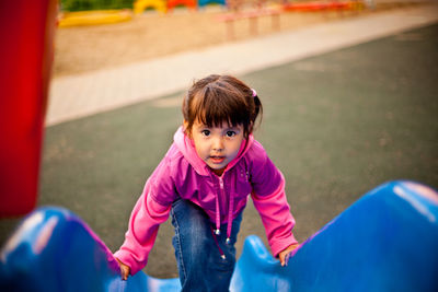 Portrait of smiling girl in playground