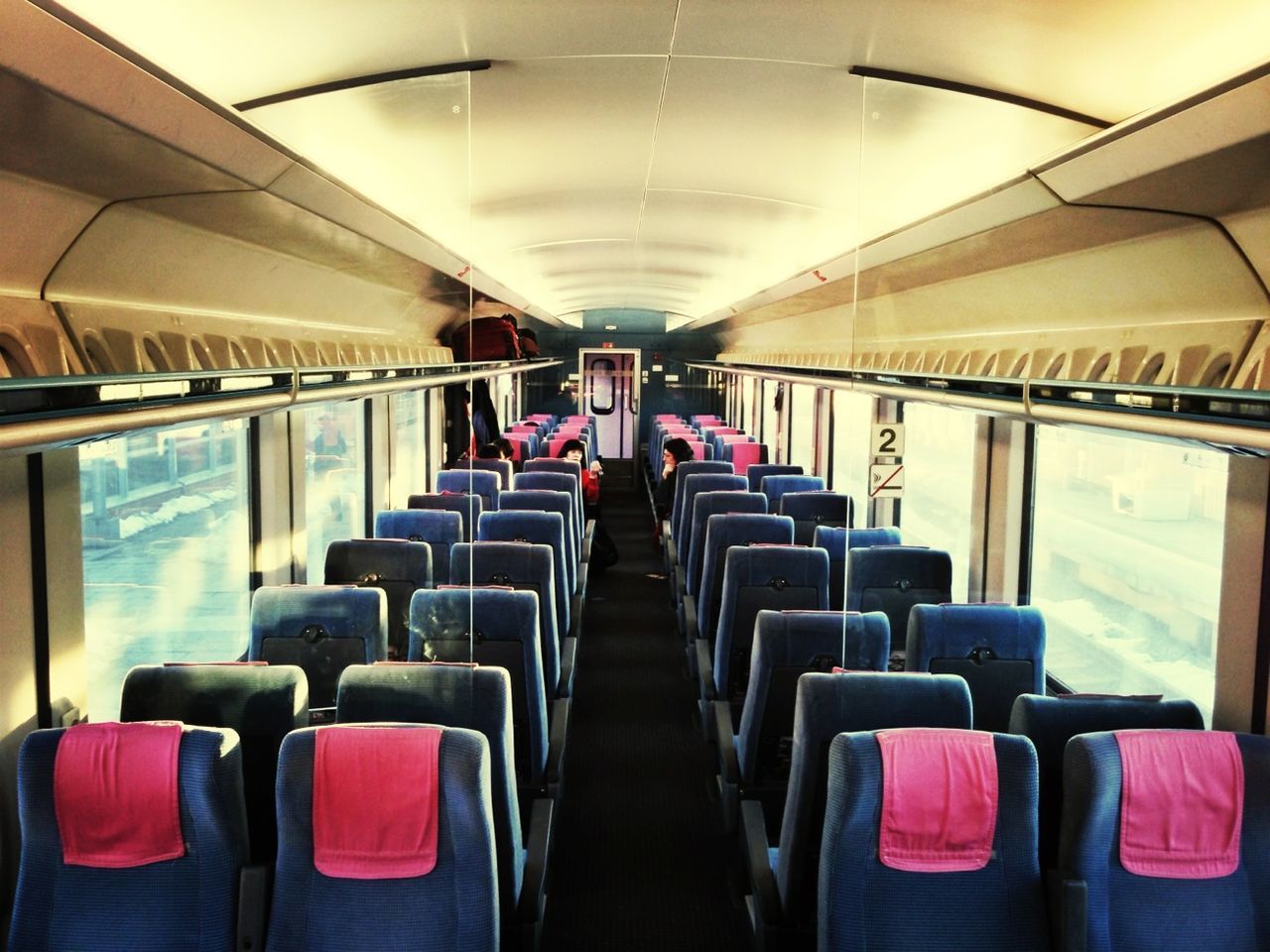 indoors, vehicle seat, seat, chair, ceiling, public transportation, empty, absence, in a row, men, interior, illuminated, vehicle interior, transportation, subway station, person, passenger, travel, sitting