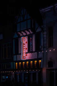 Low angle view of illuminated building at night