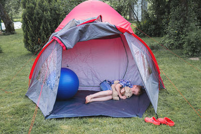 Child sleeping in a tent