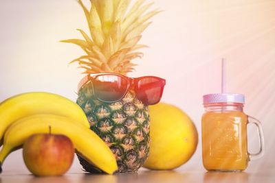 Close-up of fruits in jar on table