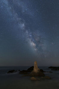 Scenic view of sea against sky at night