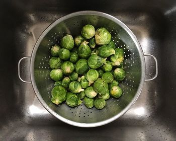 Directly above shot of brussels sprouts in colander