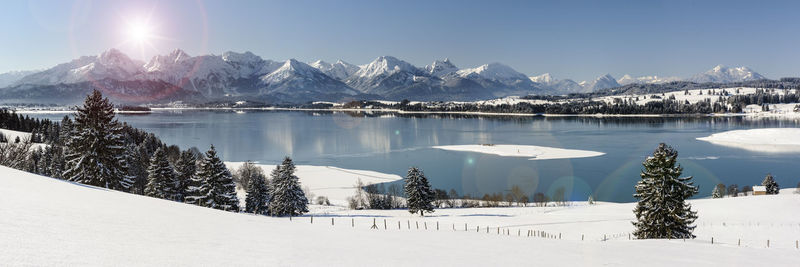 Scenic view of snow covered mountains against sky