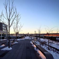 Snow covered landscape against clear sky