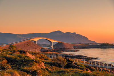 Scenic view of sea against clear sky during sunset