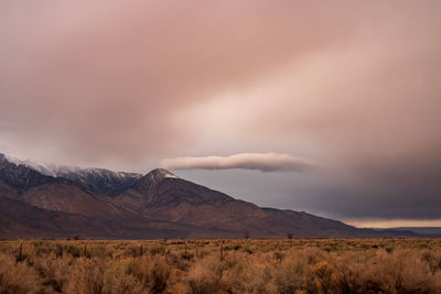 Scenic view of landscape and mountains against sky