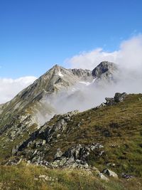 Low angle view of majestic mountains against sky