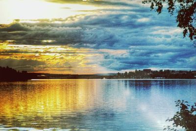 Scenic view of lake against cloudy sky