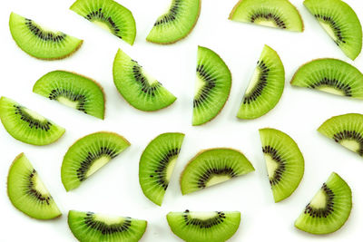 Close-up of chopped fruits over white background