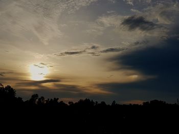 Silhouette trees against sky during sunset