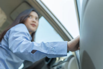 Mid adult man sitting in car