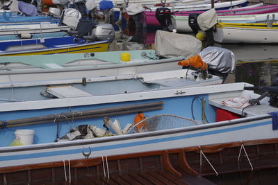 People working on boats at harbor