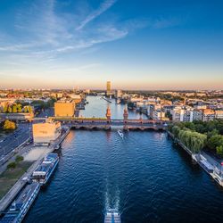 High angle view of oberbaum bridge over river in city against sky