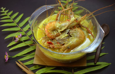 Local malaysian dish.fresh watervprawn cooked with spice on coconut tumeric gravy