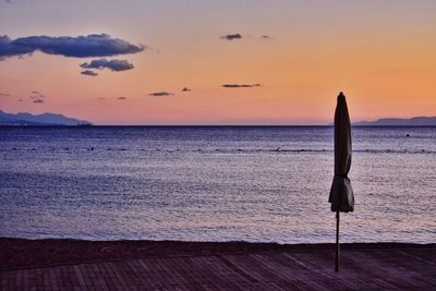 Scenic view of sea against sky at sunset