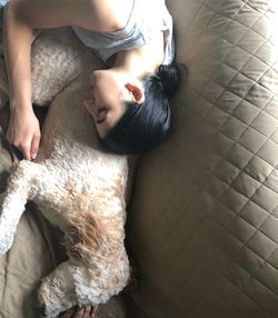 High angle view of woman sleeping on bed at home