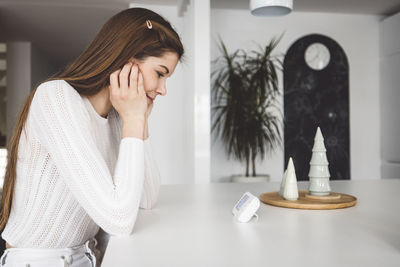 Portrait of young woman using mobile phone