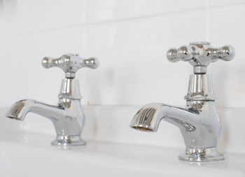 Close-up of vintage chrome faucet in bathroom