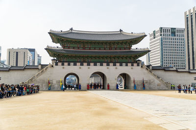 People in front of building