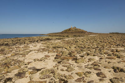 Scenic view of sea against clear blue sky