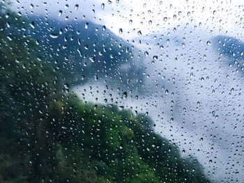 Full frame shot of raindrops on glass window