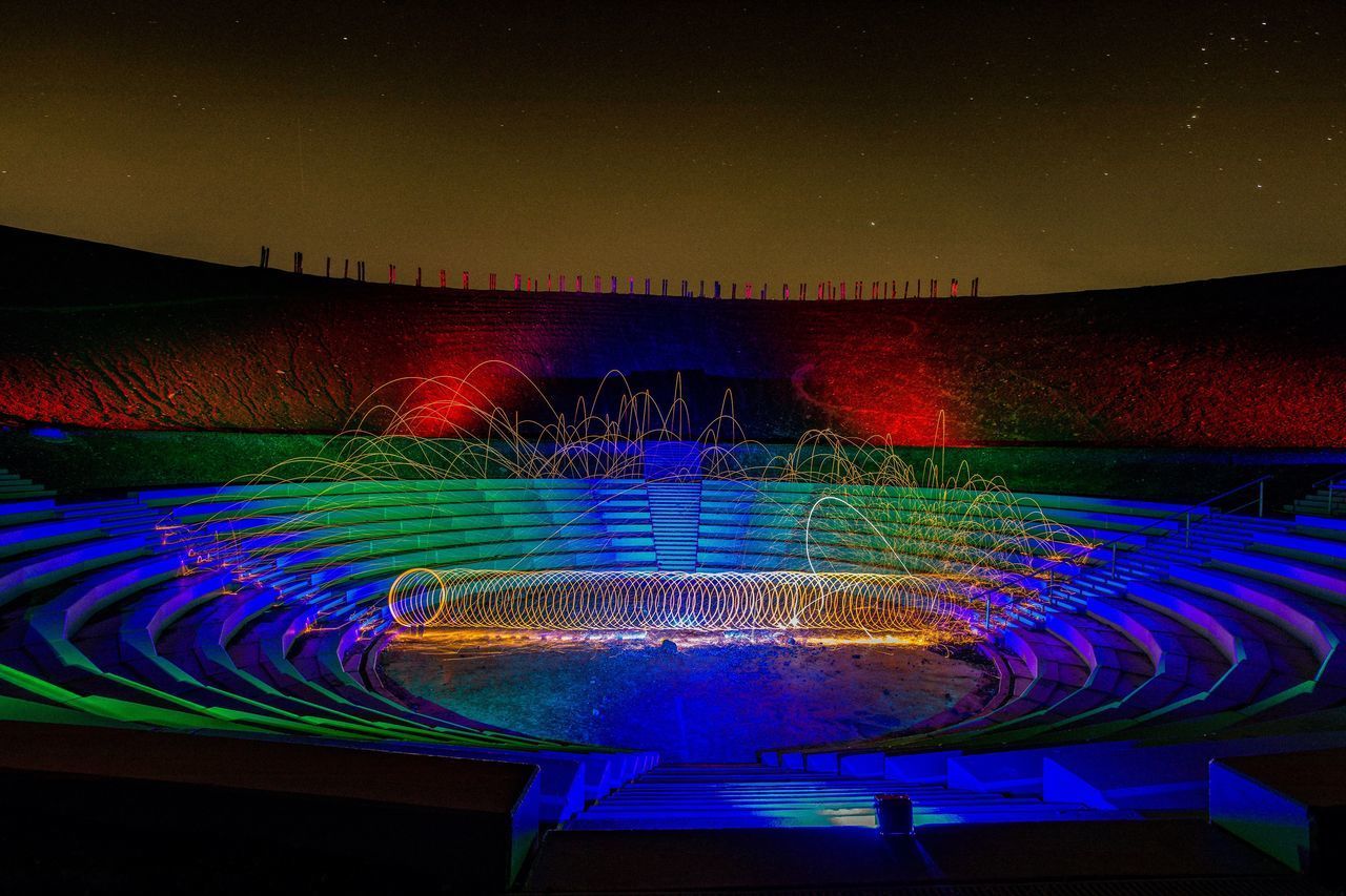 ILLUMINATED FOUNTAIN AGAINST BLUE SKY