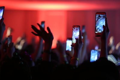 People photographing at music concert