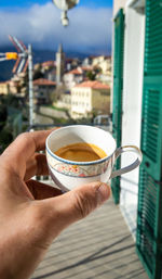 Midsection of woman holding tea cup