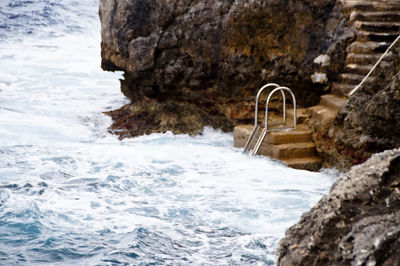 Scenic view of sea by rocks