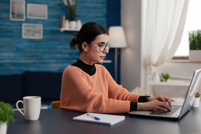 Young businesswoman working at office