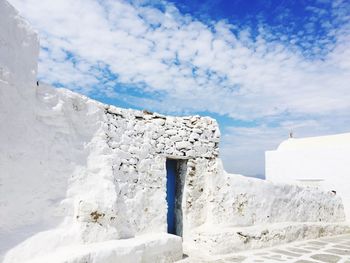 White built structure against blue sky during winter